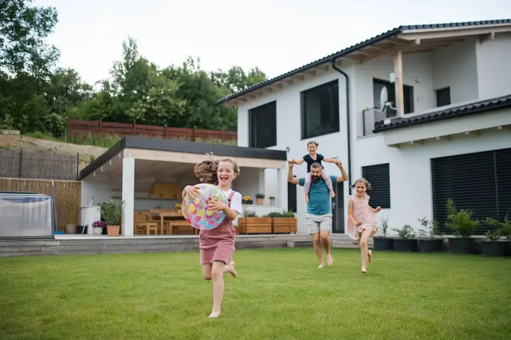 happy family running in yard